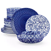 Selene 16-piece porcelain set with indigo floral and geometric patterns on plates - bowls - and mugs displayed on a dining table