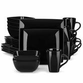A glossy black 24-piece stoneware dinnerware set from the Soho collection - featuring a sleek square design with plates and mugs for 6 people-vancasso