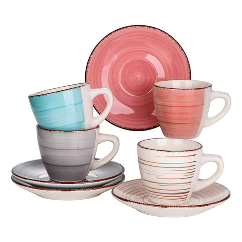 Steaming coffee served in colorful spiral stoneware cups and saucers-handmade vintage design - A