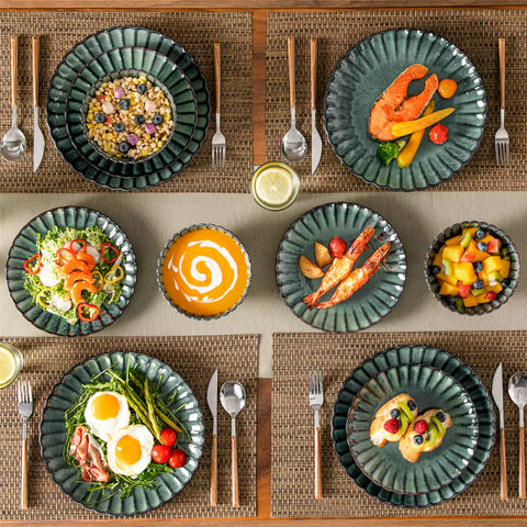 Green reactive glaze stoneware bowls and plates from the Adonis 12 piece set with brown placemats and fresh flowers