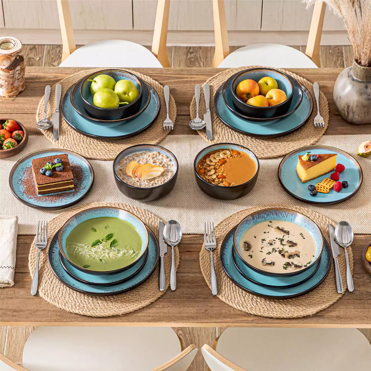 Assorted dishes with soup - dessert - and fruit salad on rustic wooden table - Amber 16-Piece blue stoneware dinnerware set with plates and bowls by vancasso