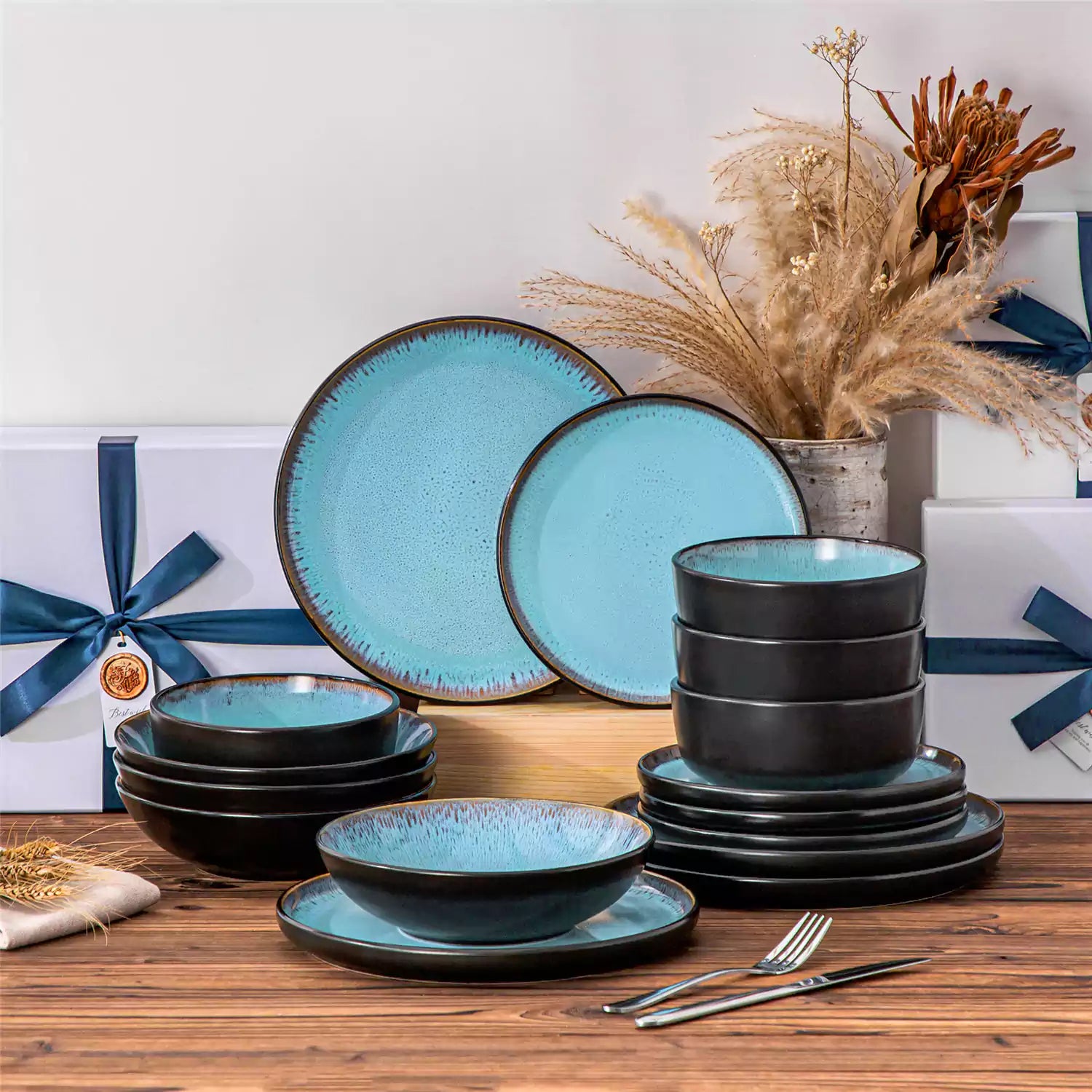 Assorted dishes with soup - dessert - and fruit salad on rustic wooden table - Amber 16-Piece blue stoneware dinnerware set with plates and bowls by vancasso