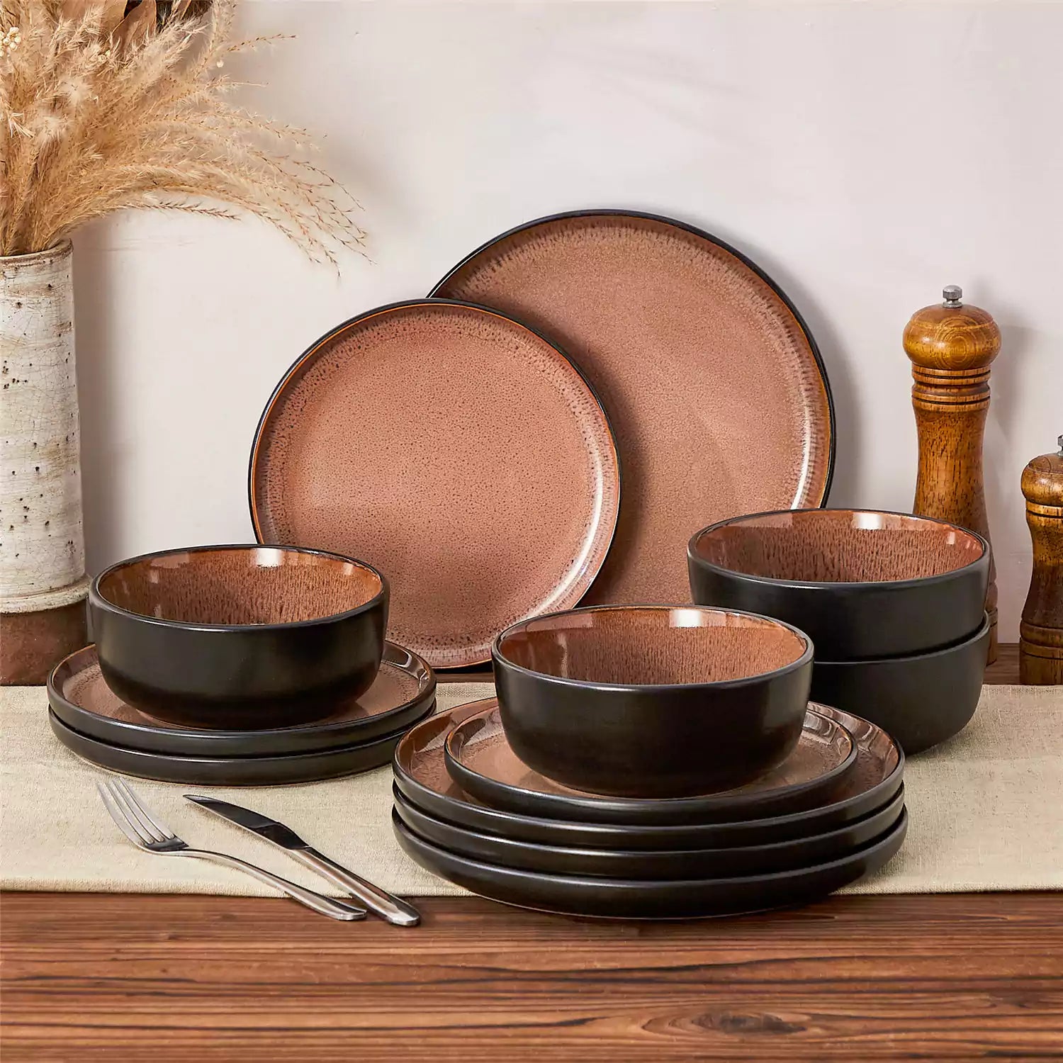 Rustic dining table with Amber 12-piece stoneware dinnerware in farmhouse red - featuring reactive glaze plates - bowls - and utensils by vancasso