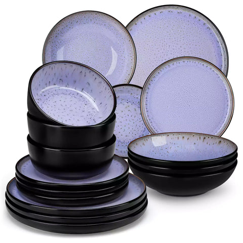 Assorted dishes with soup - dessert - and fruit salad on rustic wooden table - Amber 16-Piece violet stoneware dinnerware set with plates and bowls by vancasso