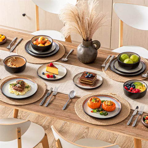 Rustic dining table with Amber 12-piece stoneware dinnerware in farmhouse beige - featuring reactive glaze plates - bowls - and utensils by vancasso