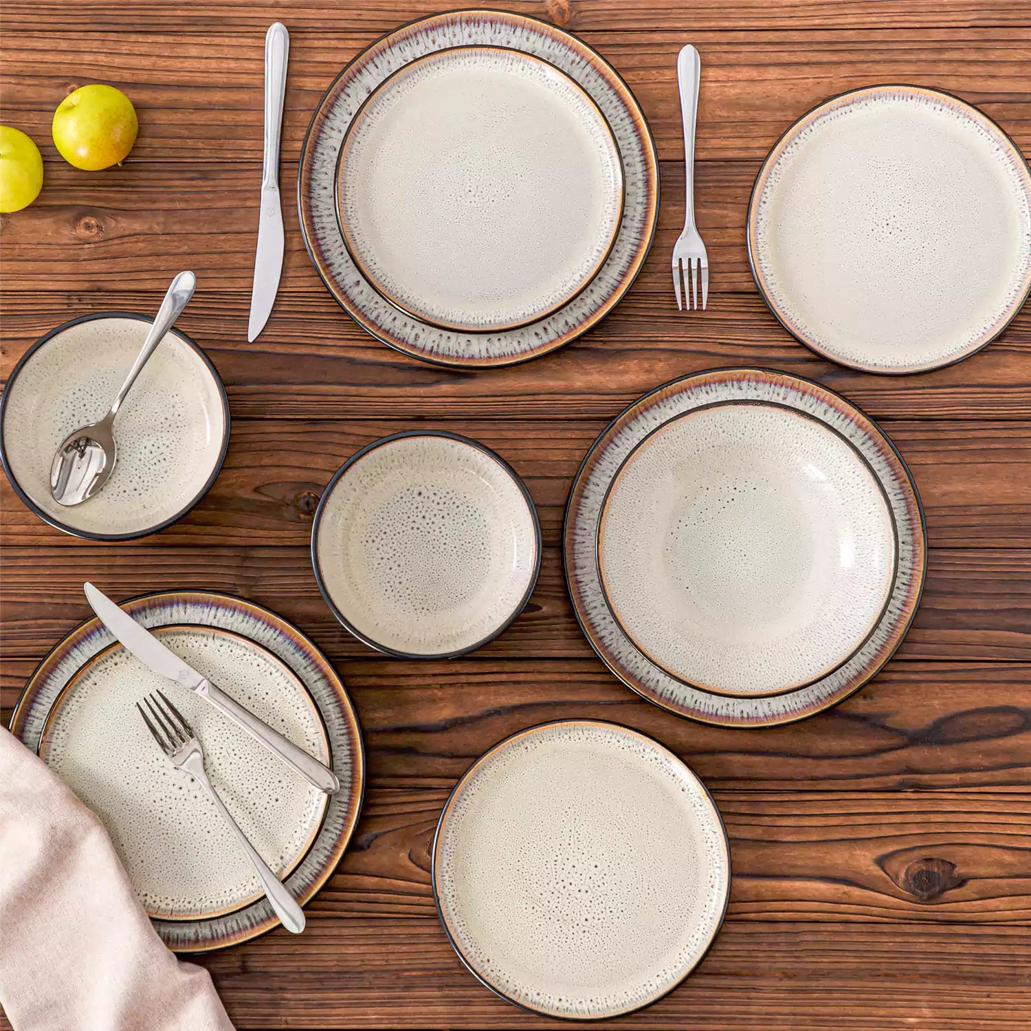 Assorted dishes with soup - dessert - and fruit salad on rustic wooden table - Amber 16-Piece beige stoneware dinnerware set with plates and bowls by vancasso