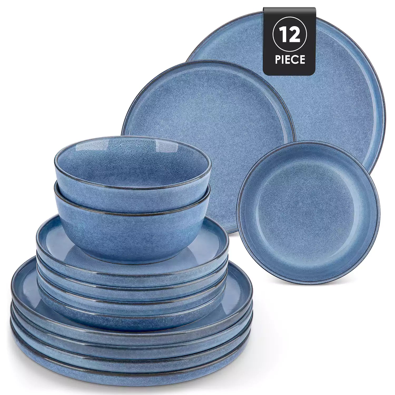 Blue stoneware plates and bowls with reactive glaze on farmhouse wooden table with woven placemats