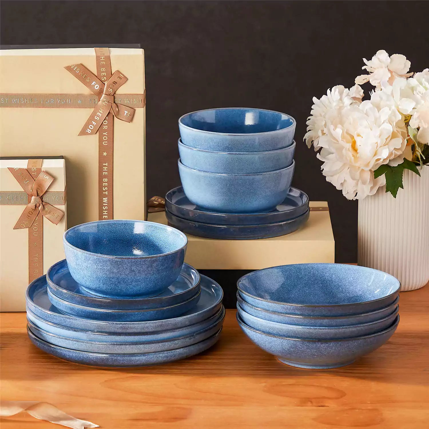 Handcrafted blue stoneware with reactive glaze on woven placemats - perfect for farmhouse tables
