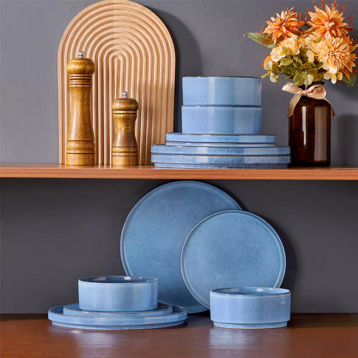Anya 12 piece straight edge stoneware dinner set in blue with food on a rustic farmhouse wooden table with a side salad and cutlery