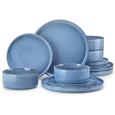 Anya 12 piece straight edge stoneware dinner set in blue with food on a rustic farmhouse wooden table with a side salad and cutlery