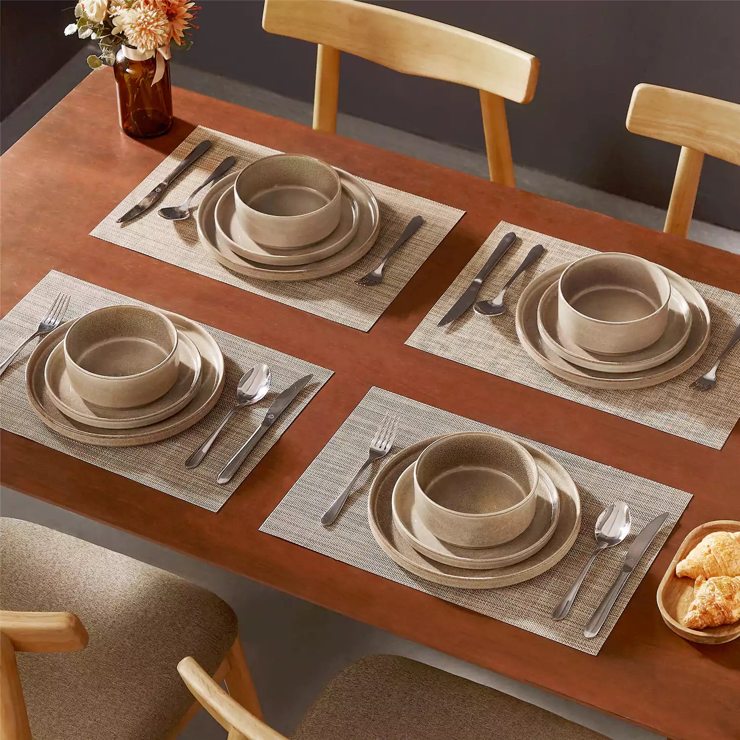 Anya 12 piece straight edge stoneware dinner set in caramel with food on a rustic farmhouse wooden table with a side salad and cutlery