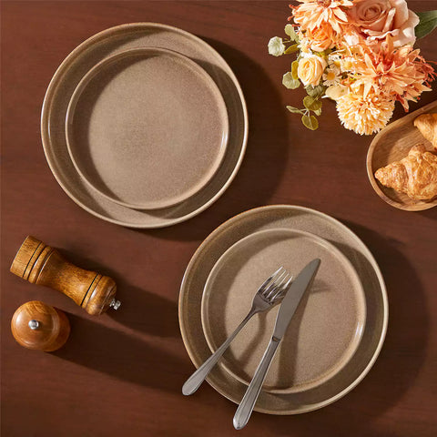 Anya 16 piece straight edge stoneware dinner set in caramel with pasta soup and pastries on a modern farmhouse table