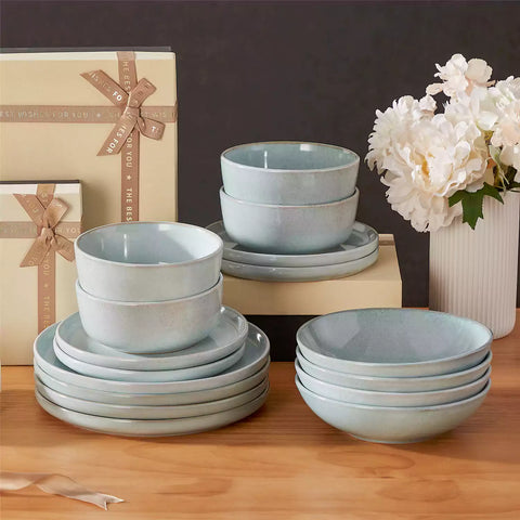Handcrafted mint green stoneware with reactive glaze on woven placemats - perfect for farmhouse tables