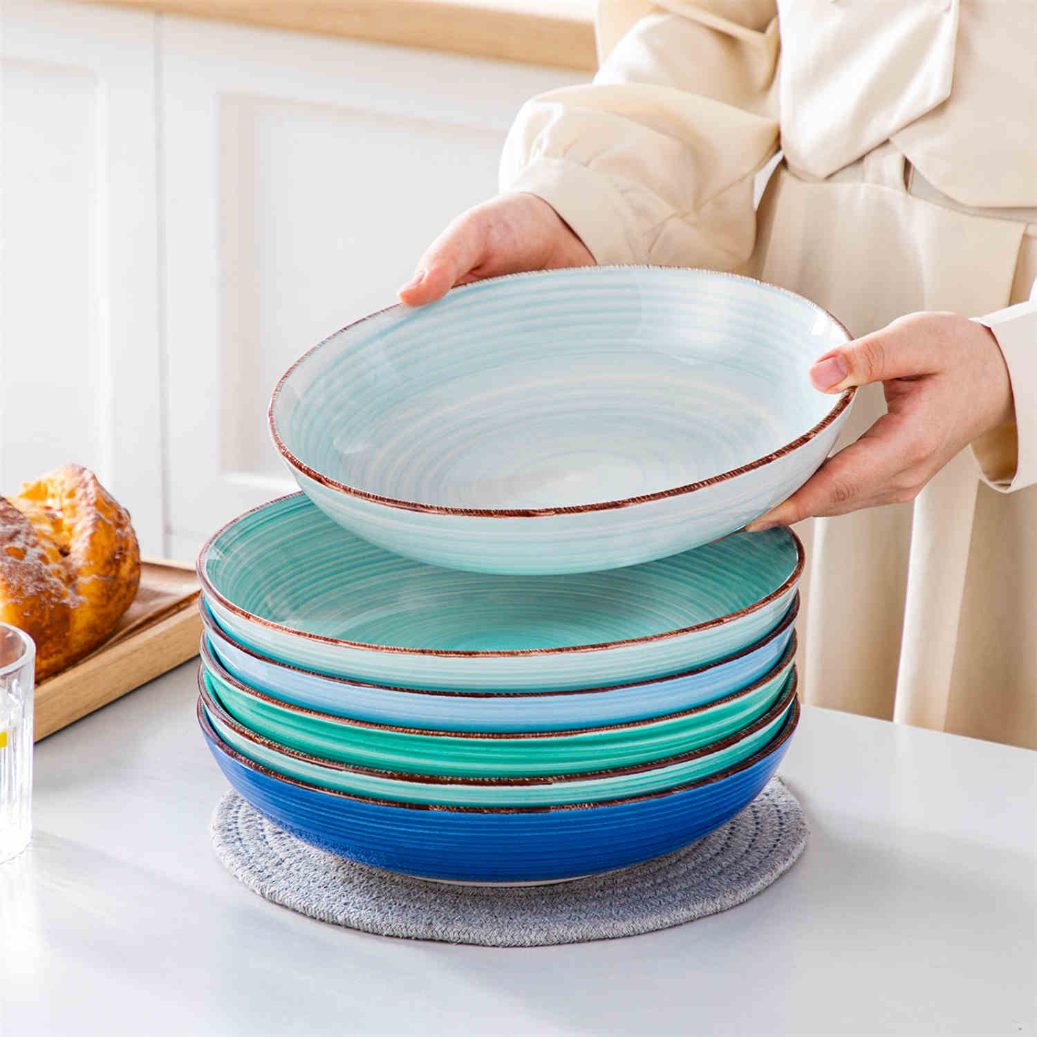 Blue Bonita large stoneware bowls set of 6 on a white table - each filled with pasta - pumpkin soup - and fruit salad - creating a bright and inviting table setting