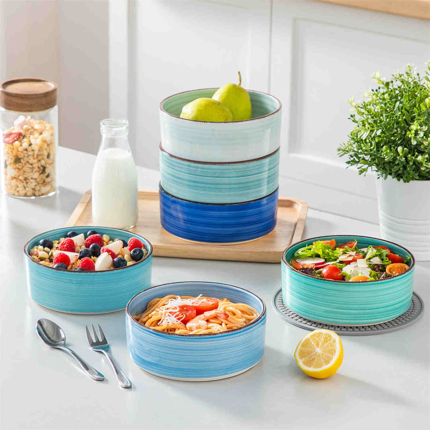 Blue Bonita straight-edge cereal bowls set of 6 on a white table - filled with oats - pear - and pasta - accented with lemons and greenery for a fresh - natural look