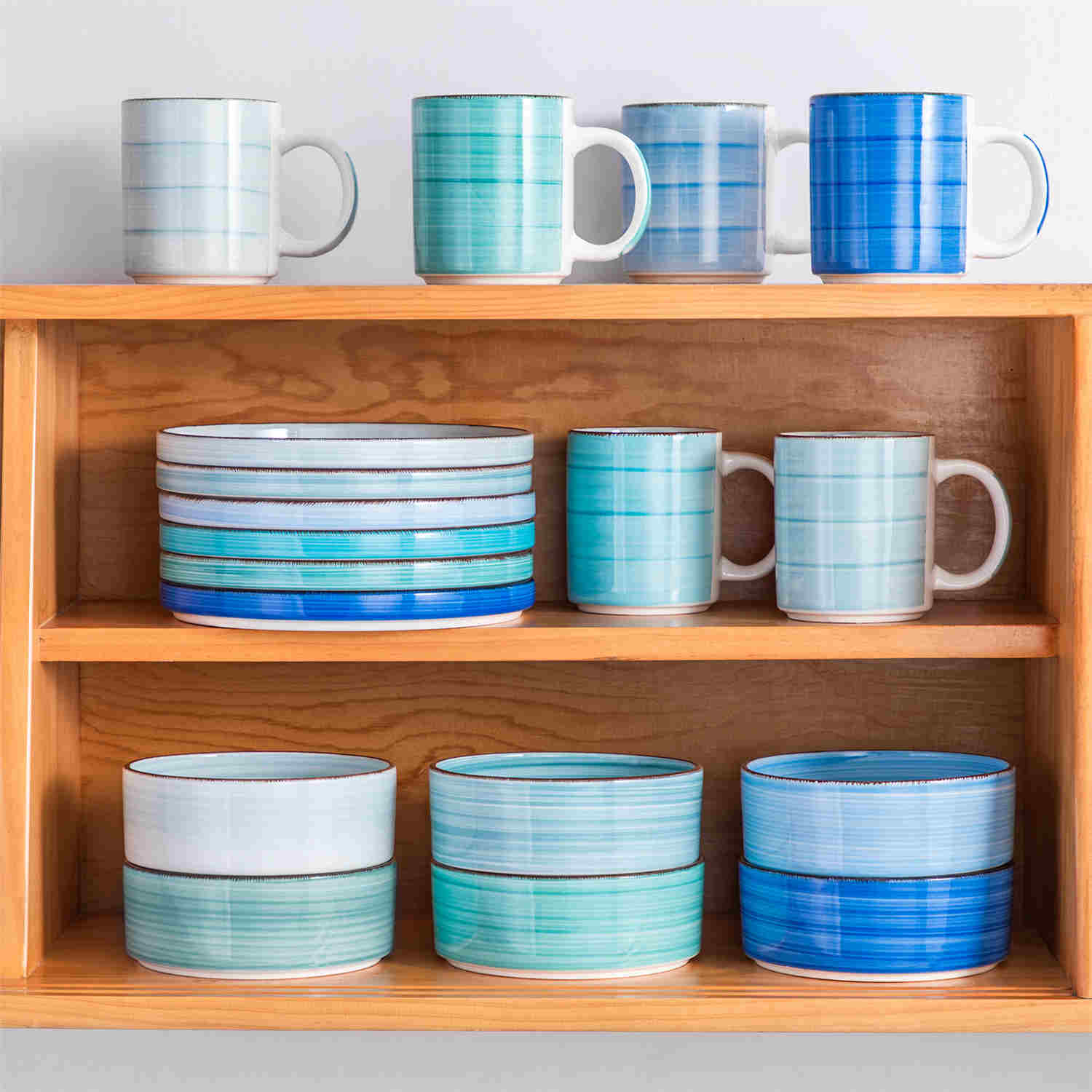 Blue Bonita straight-edge cereal bowls set of 6 on a white table - filled with oats - pear - and pasta - accented with lemons and greenery for a fresh - natural look