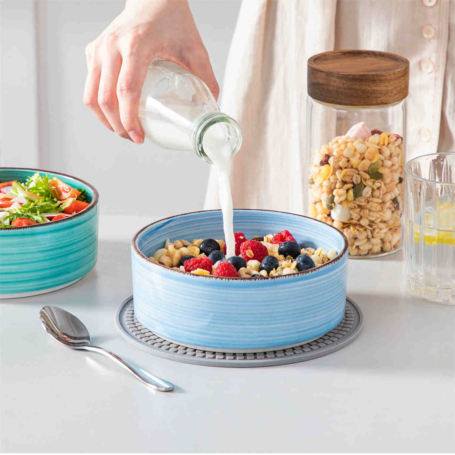 Blue Bonita straight-edge cereal bowls set of 6 on a white table - filled with oats - pear - and pasta - accented with lemons and greenery for a fresh - natural look