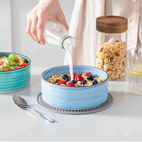 Blue Bonita straight-edge cereal bowls set of 6 on a white table - filled with oats - pear - and pasta - accented with lemons and greenery for a fresh - natural look