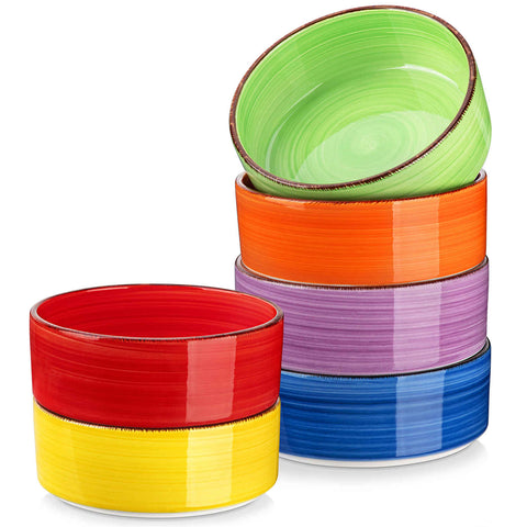 Multicolor Bonita straight-edge cereal bowls set of 6 on a white table - filled with oats - pear - and pasta - accented with lemons and greenery for a fresh - natural look