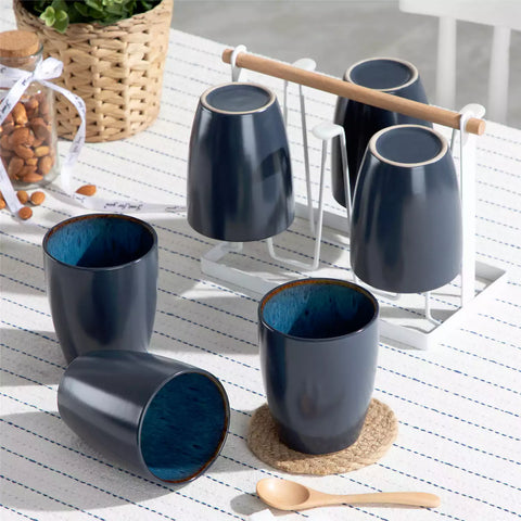 Set of 6 bubble stoneware mugs in rich blue - green - and brown tones with reactive glaze and matte black exterior - ideal for coffee -  tea - or cozy mornings - Blue