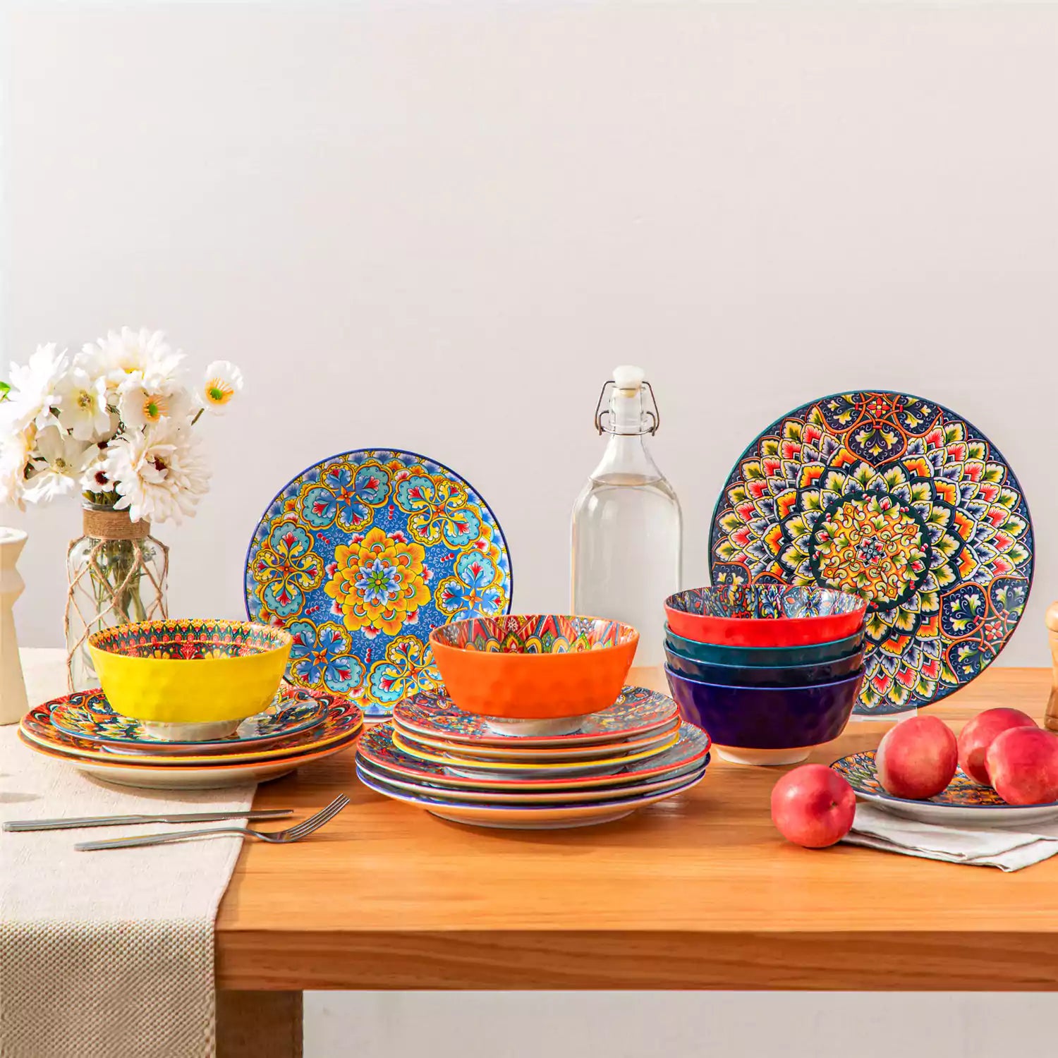 Bohemian Lumi porcelain dinnerware set for 6 with vibrant patterned plates diamond-embossed bowls served with fresh food bread and olive oil on wooden table