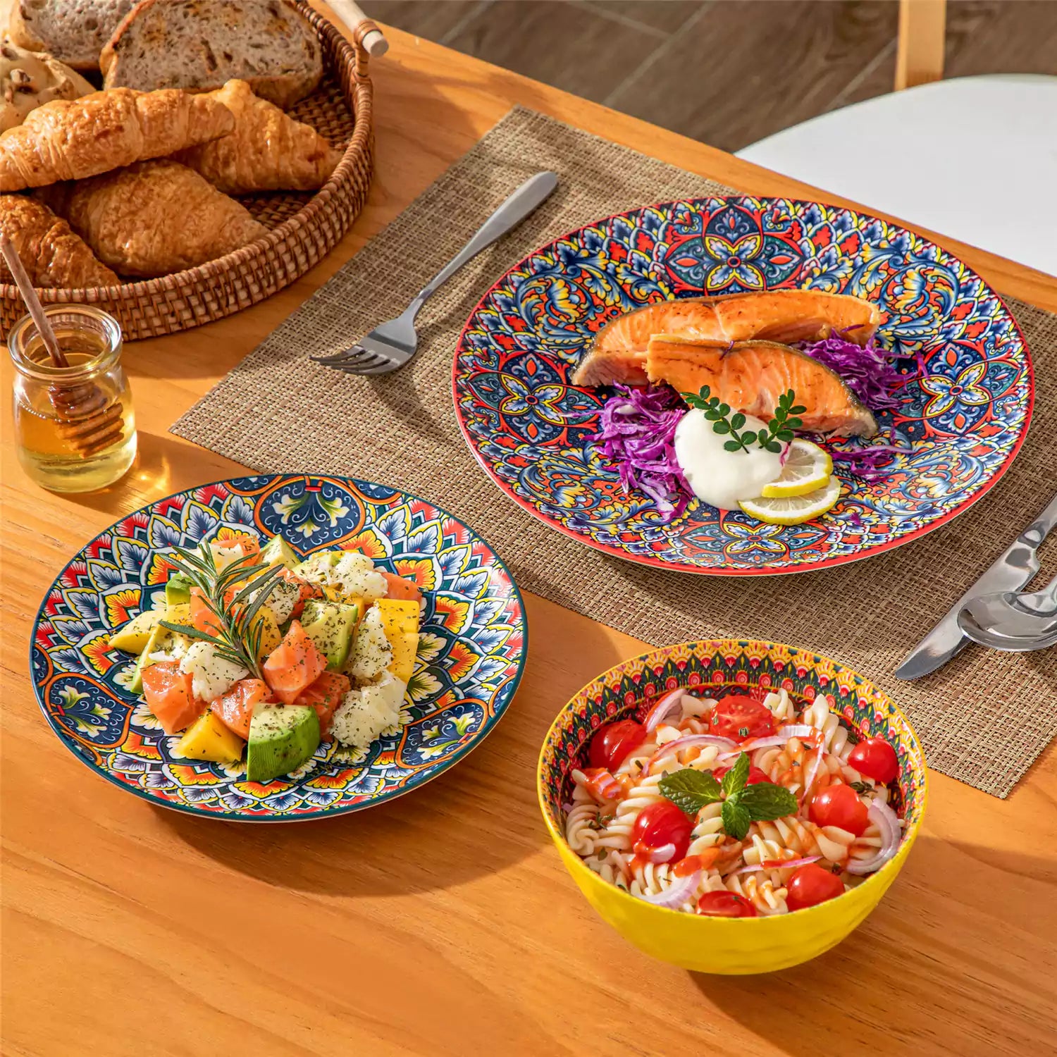 Bohemian Lumi porcelain dinnerware set for 6 with vibrant patterned plates diamond-embossed bowls served with fresh food bread and olive oil on wooden table