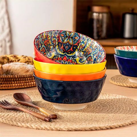 Colorful 26oz Lumi porcelain bowls on rattan placemats filled with oatmeal berries roasted broccoli and cherries on a linen table runner