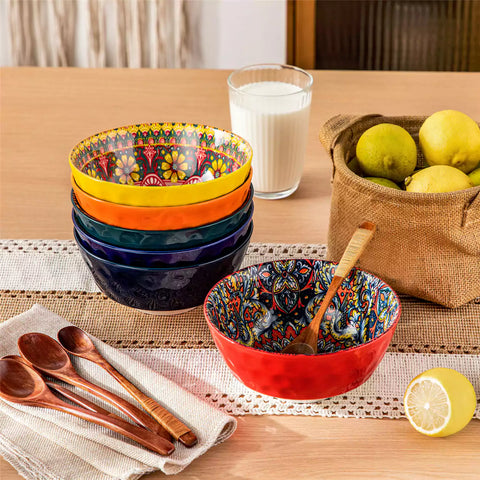 Colorful 26oz Lumi porcelain bowls on rattan placemats filled with oatmeal berries roasted broccoli and cherries on a linen table runner