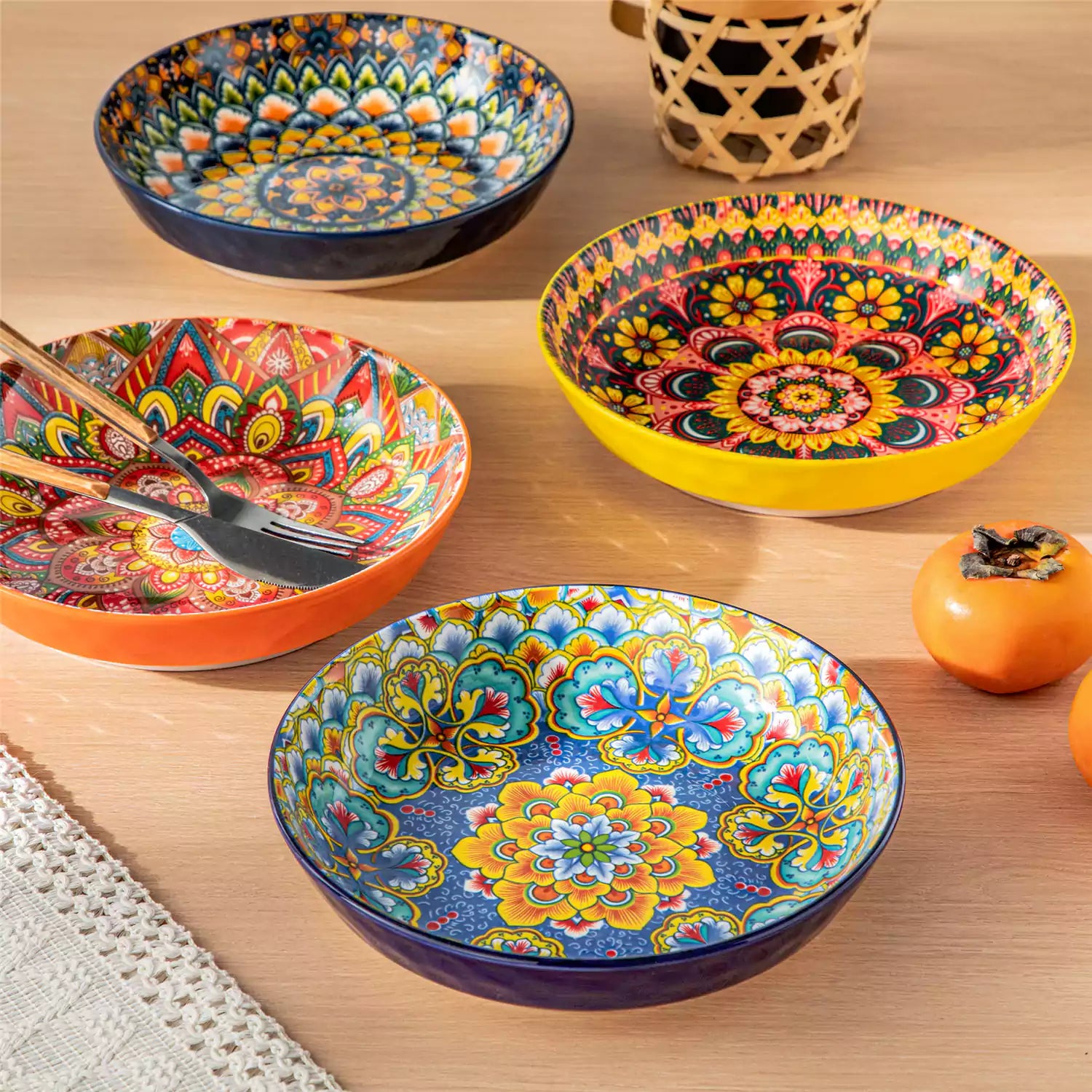 Vibrant Boho pasta bowls on a wooden table filled with pasta cherries and persimmons for a colorful, casual dining setting