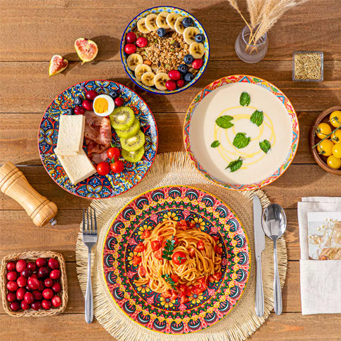 Bohemian Lumi 16 piece porcelain dinnerware set with colorful patterned plates and diamond-embossed bowls on a wooden table with assorted food and cutlery