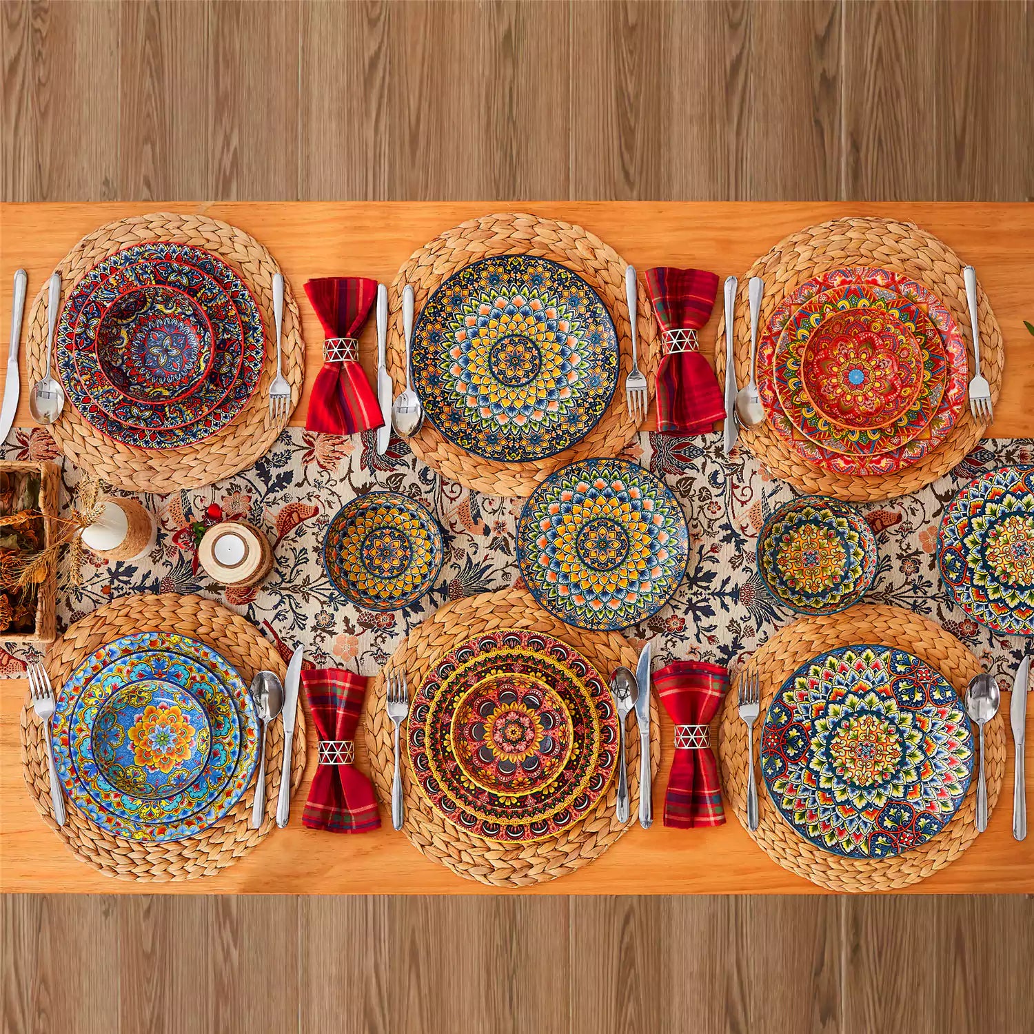 Lumi 18-piece Bohemian dinnerware set for six on a wooden table with colorful plates bowls and silverware in a playful Boho style