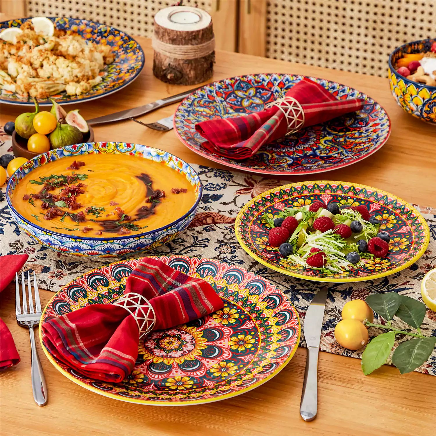 Bohemian style dining table set with Lumi 24 piece colorful dinnerware bowls and vibrant table décor ready for a lively meal