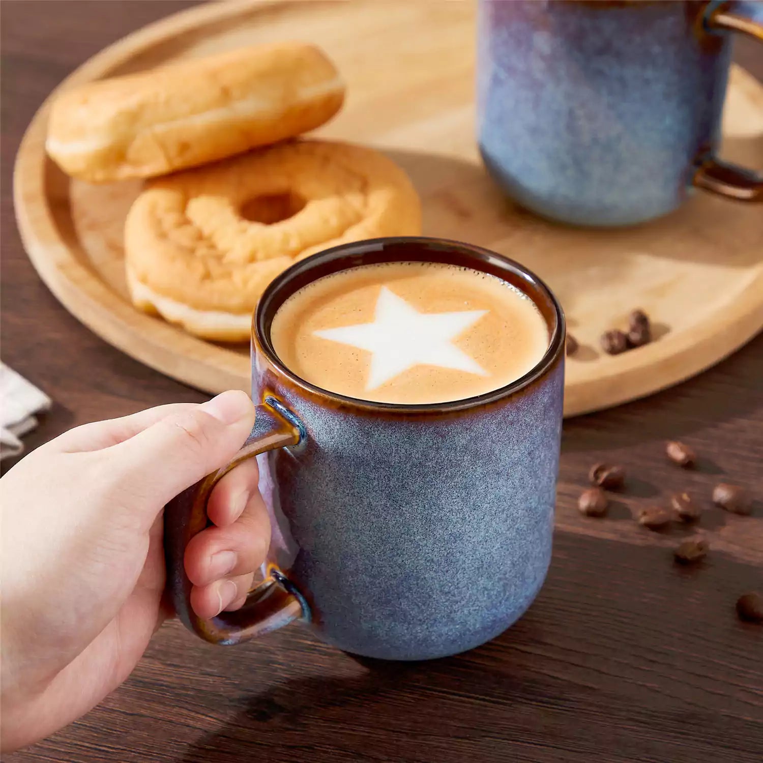 Cup of coffee with latte art cookies and coffee beans on a wooden table featuring onion mugs set of 4 in 12oz