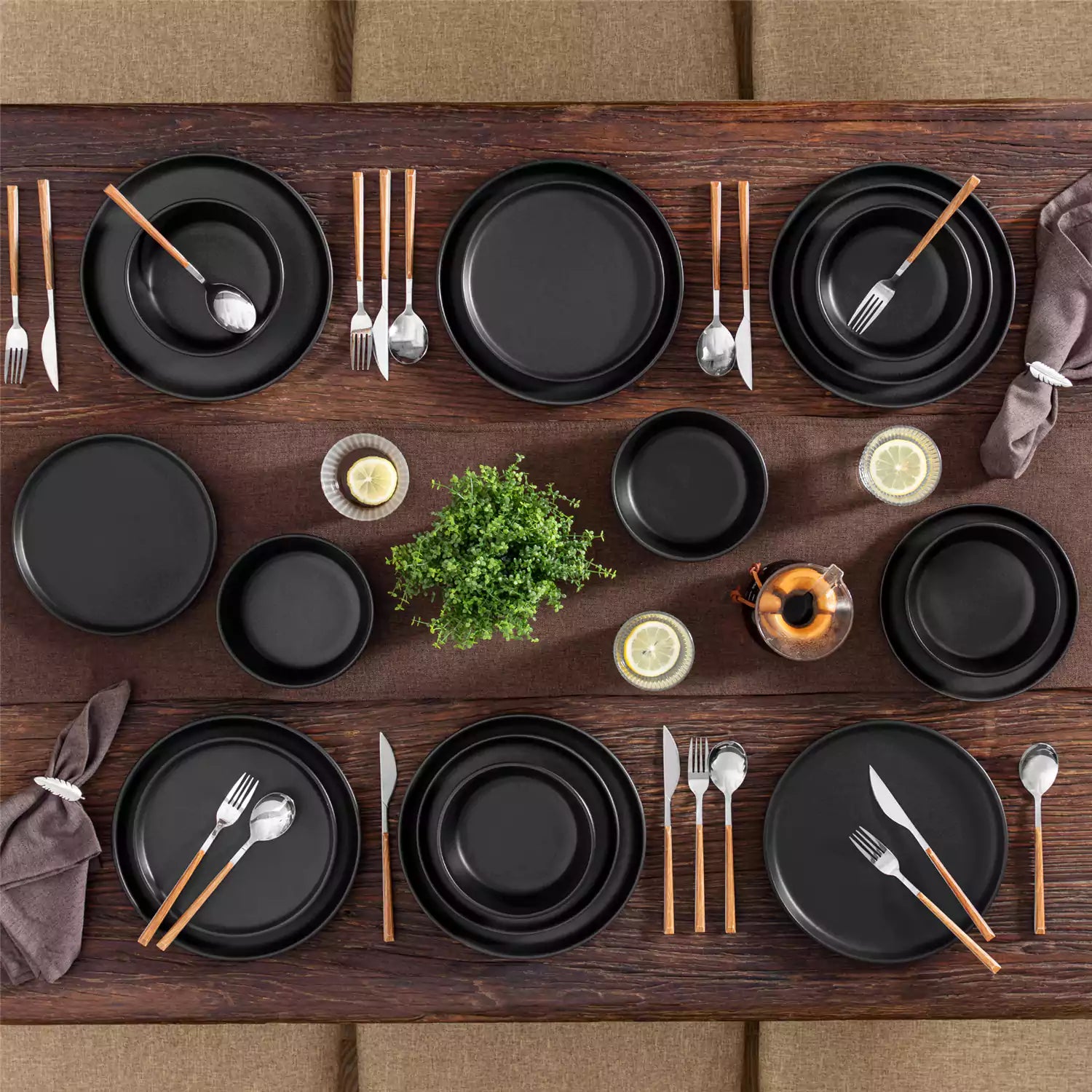 Playa 18-Piece Stoneware Dinnerware Set for 6, featuring plates and bowls in a modern Ibiza-inspired style with a matte black finish-vancasso