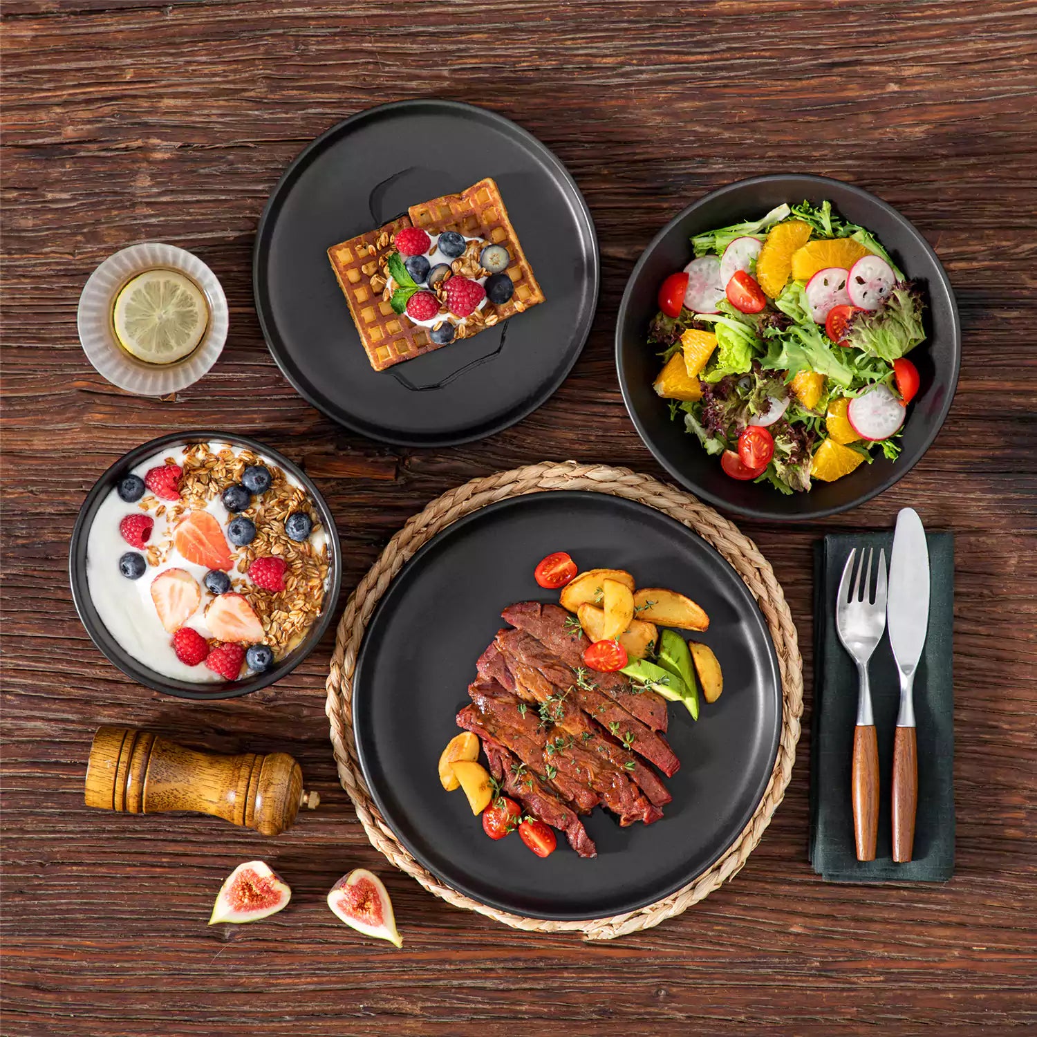 A matte black 24-piece stoneware dinnerware set from the Playa collection by vancasso - adding a modern flair with plates and bowls for 6 people