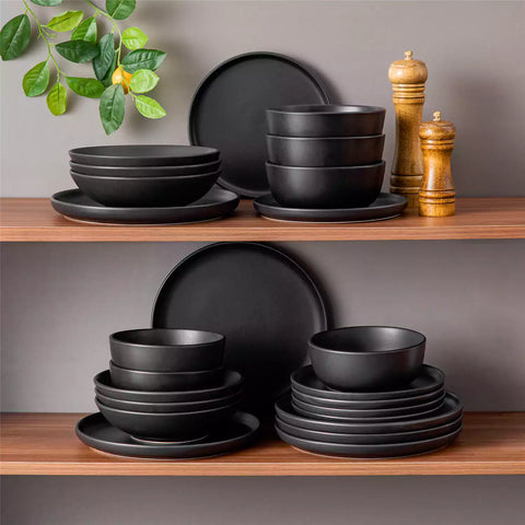 A matte black 24-piece stoneware dinnerware set from the Playa collection by vancasso - adding a modern flair with plates and bowls for 6 people