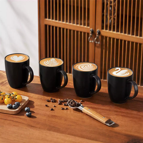 Playa 16oz stoneware mug in black on a rustic wooden kitchen table for a modern breakfast with coffee and fresh fruit
