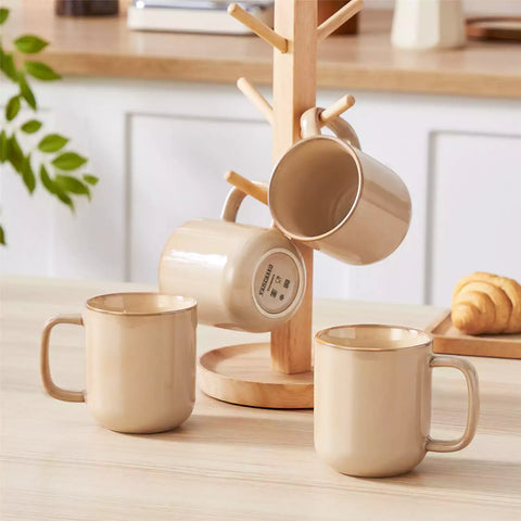 Playa 12oz stoneware mugs in glossy brown reactive glaze on a rustic wooden table for a cozy breakfast with fresh coffee pastries and berries