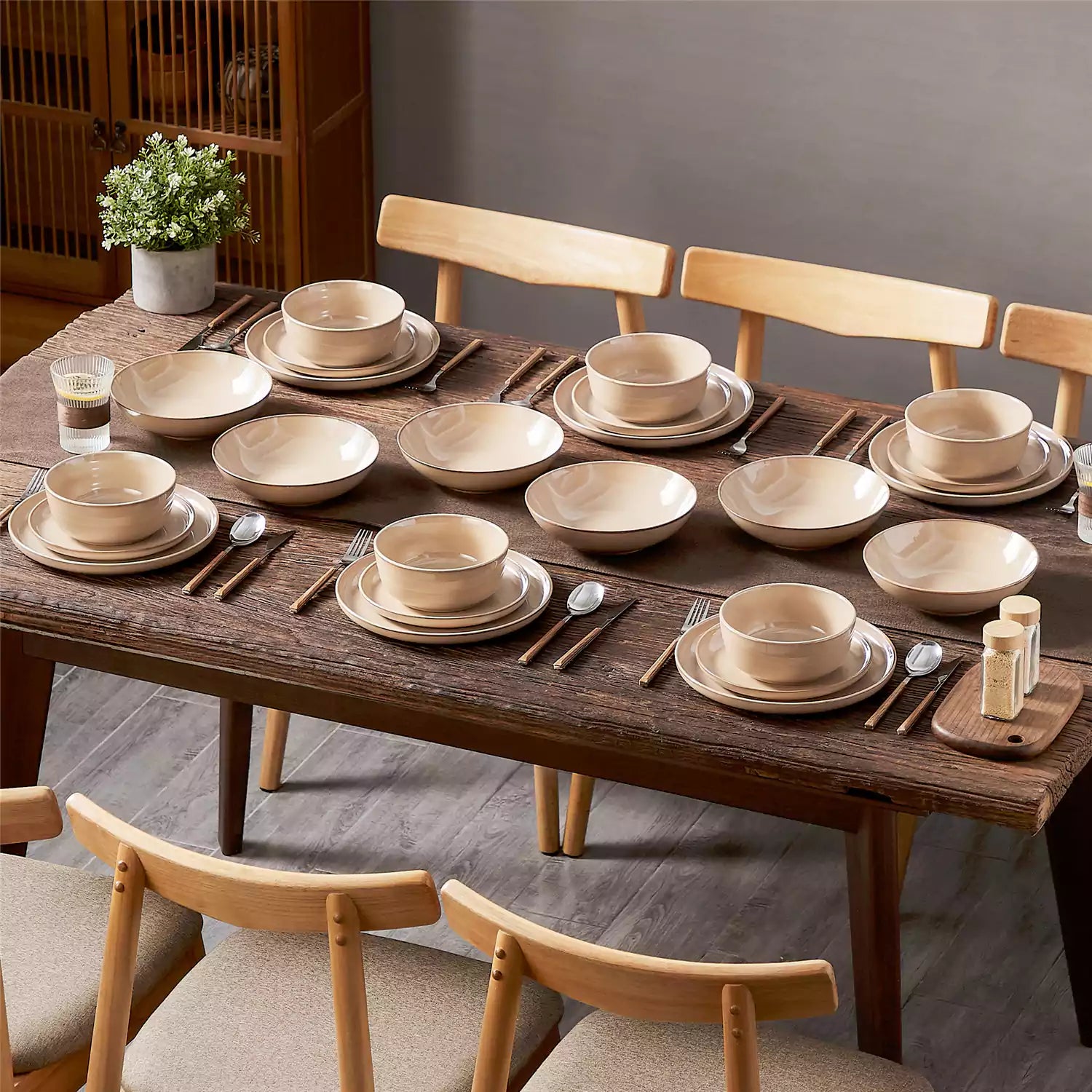 A glossy caramel 24-piece stoneware dinnerware set from the Playa collection - featuring farmhouse charm with plates and bowls for 6 people-vancasso