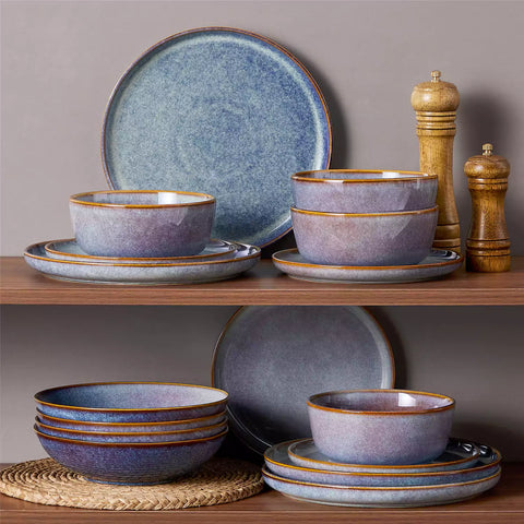 A glossy deep indigo 16-piece stoneware dinnerware set from the Playa collection - featuring farmhouse charm with plates and bowls for 4 people-vancasso