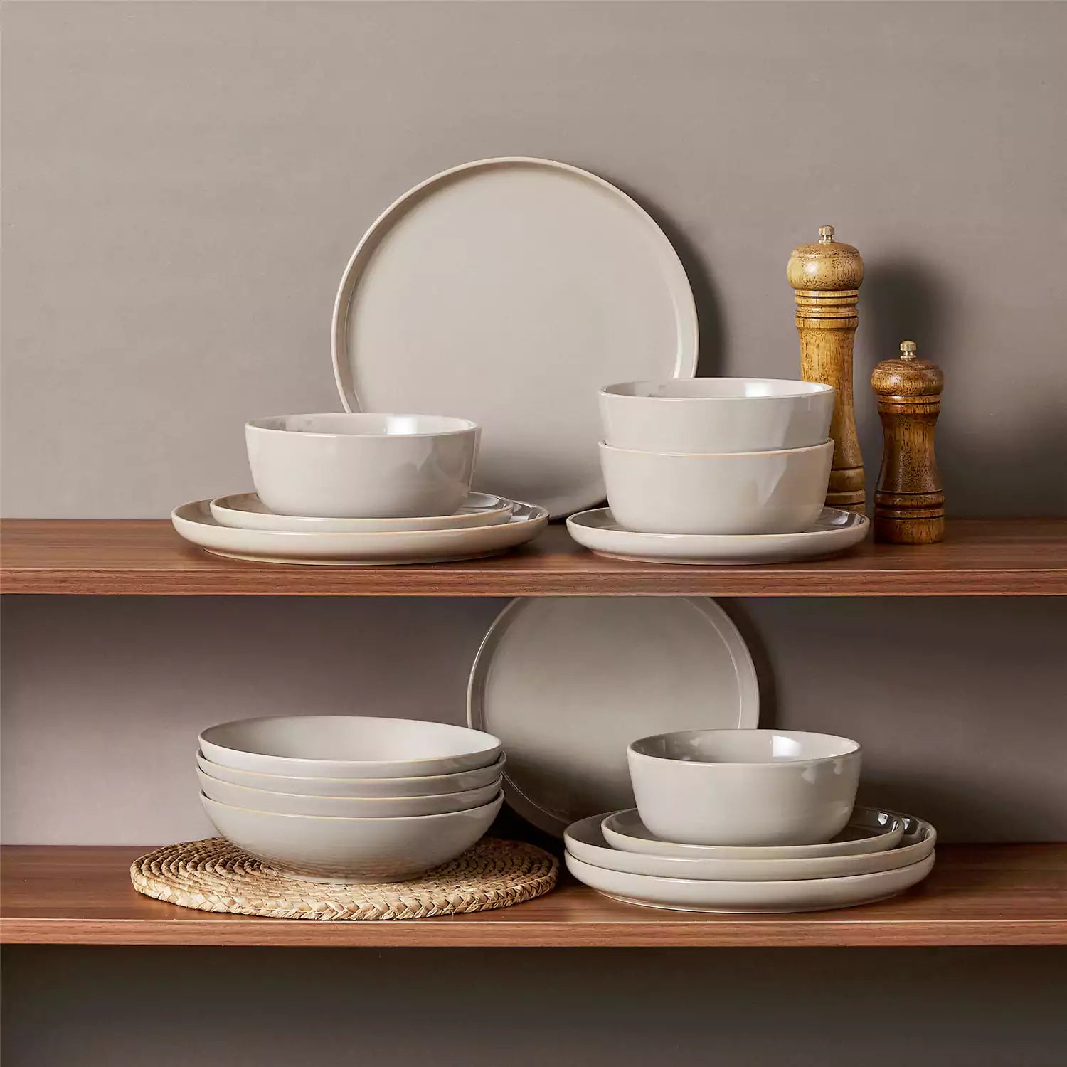 A glossy grey 16-piece stoneware dinnerware set from the Playa collection - featuring farmhouse charm with plates and bowls for 4 people-vancasso