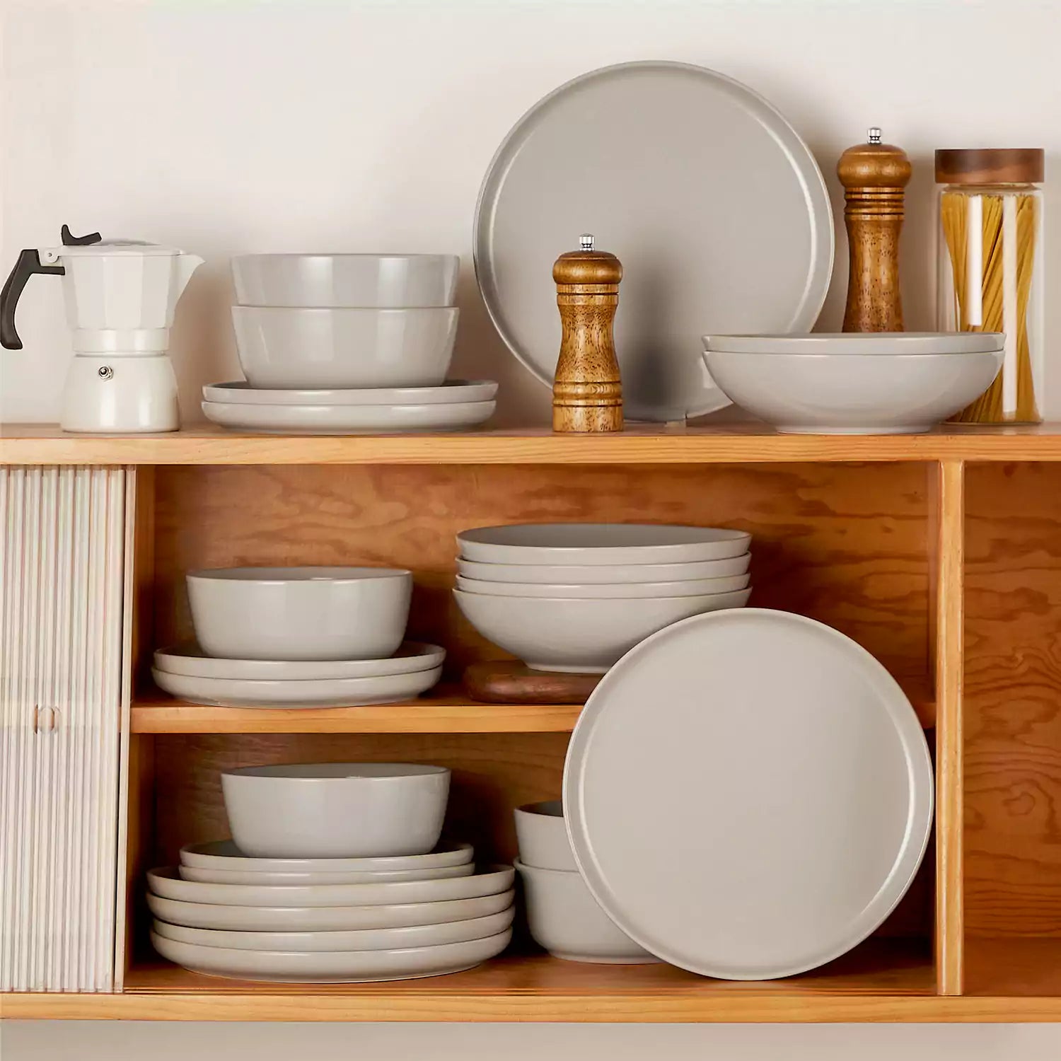 A glossy grey 24-piece stoneware dinnerware set from the Playa collection - featuring farmhouse charm with plates and bowls for 6 people-vancasso
