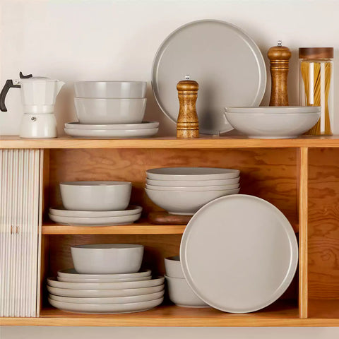 A glossy grey 24-piece stoneware dinnerware set from the Playa collection - featuring farmhouse charm with plates and bowls for 6 people-vancasso