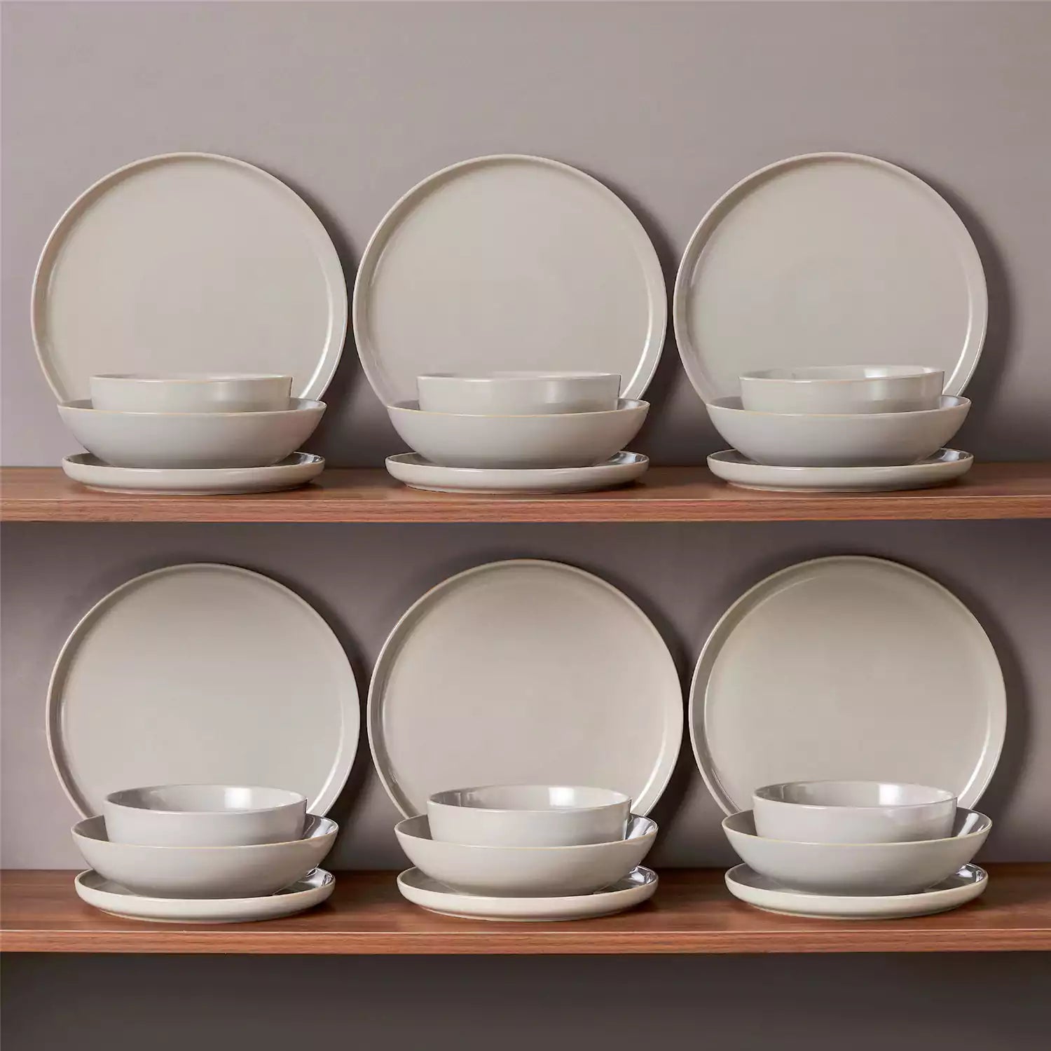 A glossy grey 24-piece stoneware dinnerware set from the Playa collection - featuring farmhouse charm with plates and bowls for 6 people-vancasso