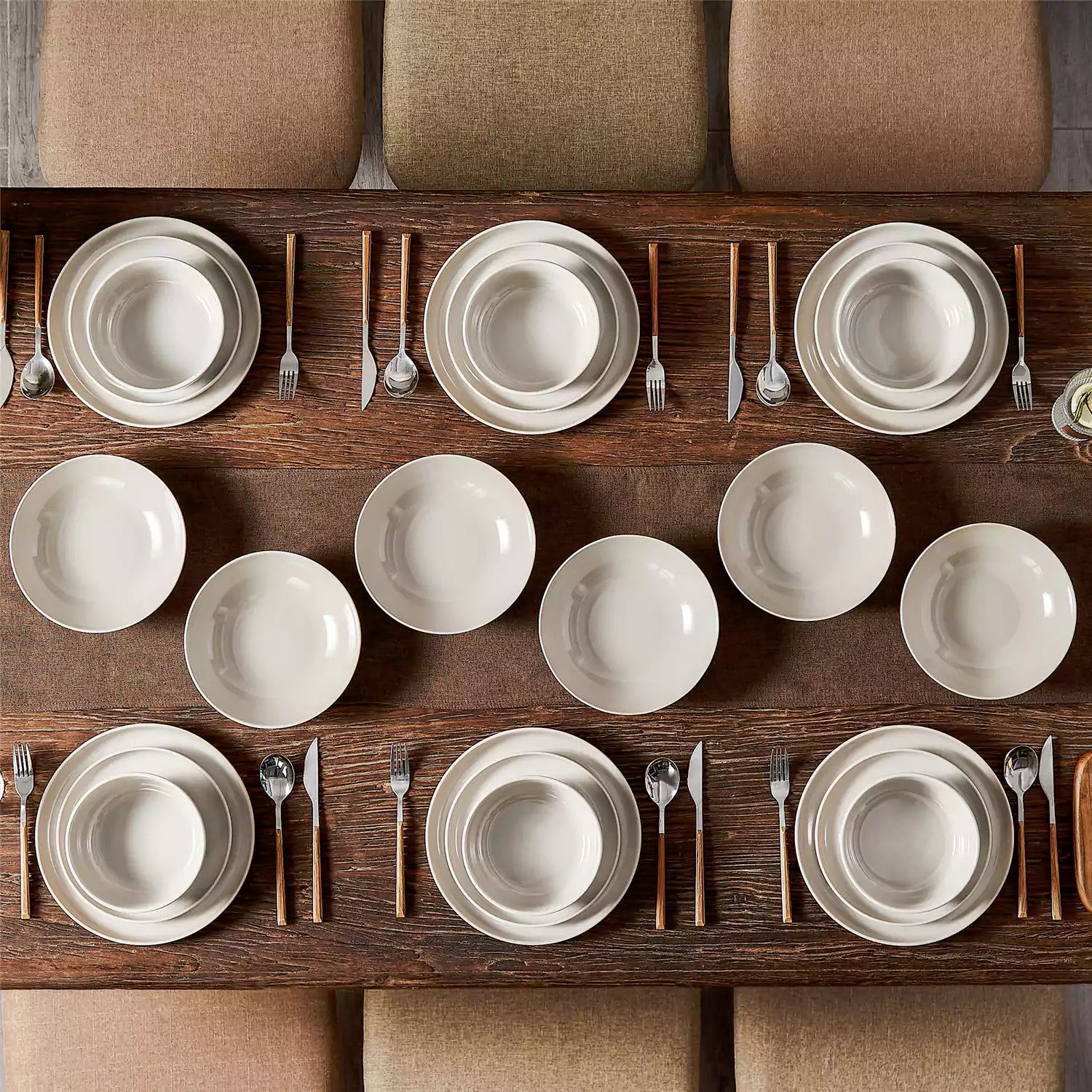 A glossy grey 24-piece stoneware dinnerware set from the Playa collection - featuring farmhouse charm with plates and bowls for 6 people-vancasso