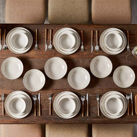 A glossy grey 24-piece stoneware dinnerware set from the Playa collection - featuring farmhouse charm with plates and bowls for 6 people-vancasso