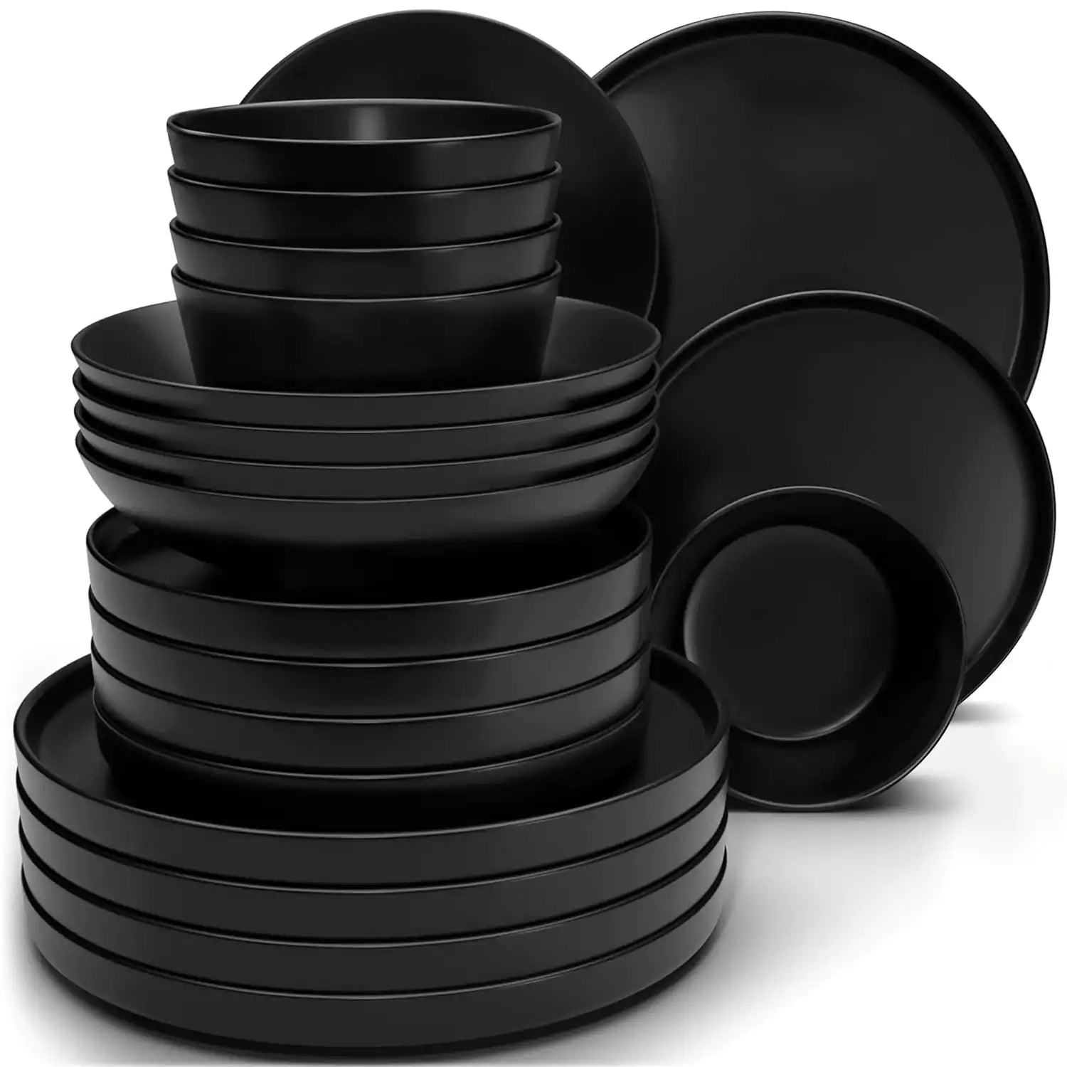 Modern black stoneware bowl and plate set displayed on a marble countertop - with a fresh salad blurred in the background - vancasso