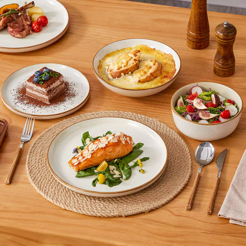 Rustic beige speckled stoneware dinnerware set with lipped-edge plates and bowls arranged on a sunlit modern dining table-vancasso
