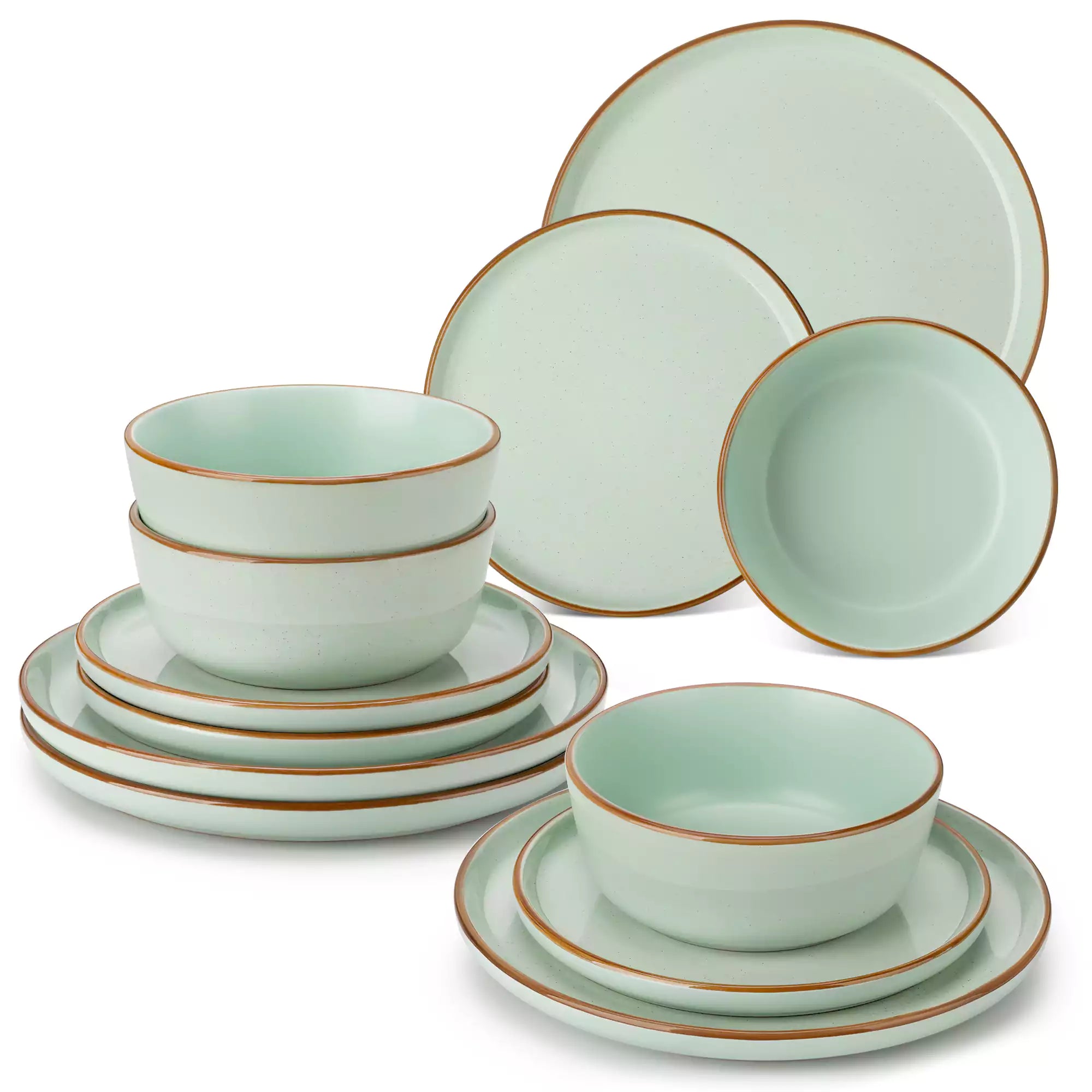 Green rustic stoneware dinnerware set with speckled - lipped-edge plates and bowls on a dining table with flowers and cutlery in a cozy modern kitchen-vancasso