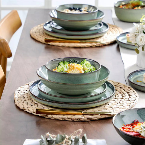 Sata green stoneware dinnerware set styled dining table with dinner plates salad plates pasta bowls cereal bowls silverware and floral centerpiece farmhouse reactive glaze service for 6